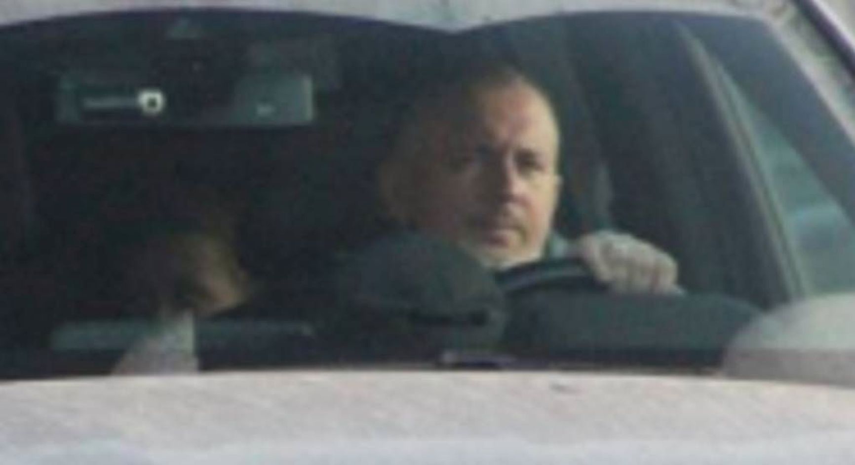 The only publicly available image of Roman Puntus. The identity of the woman in the back is unknown.